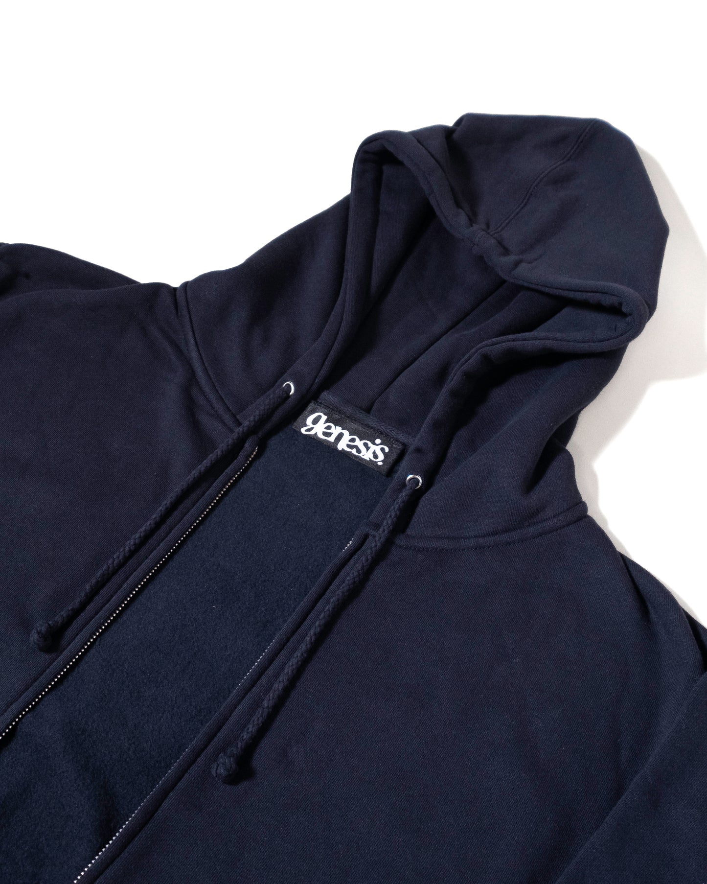 Black hoodie with 'genesis' logo on a white background