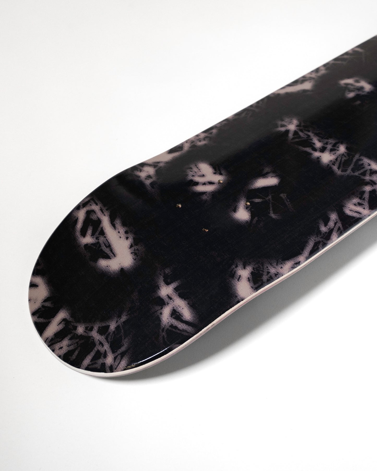 Black and white marbled patterned object on a white background